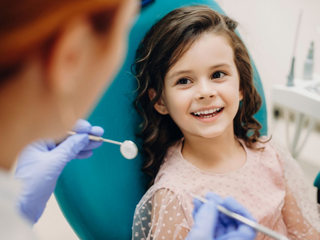 A child sitting in a dental chair at Future of Dentistry.
