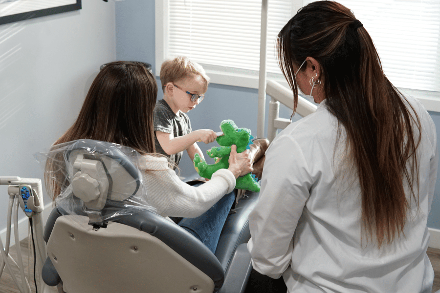 Child patient visiting the dentist with parent at Future of Dentistry in Billerica