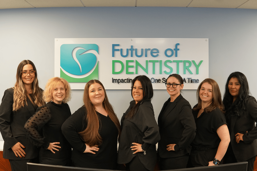 Dental Front Office team at Future of Dentistry in Wakefield, MA, standing together in the office