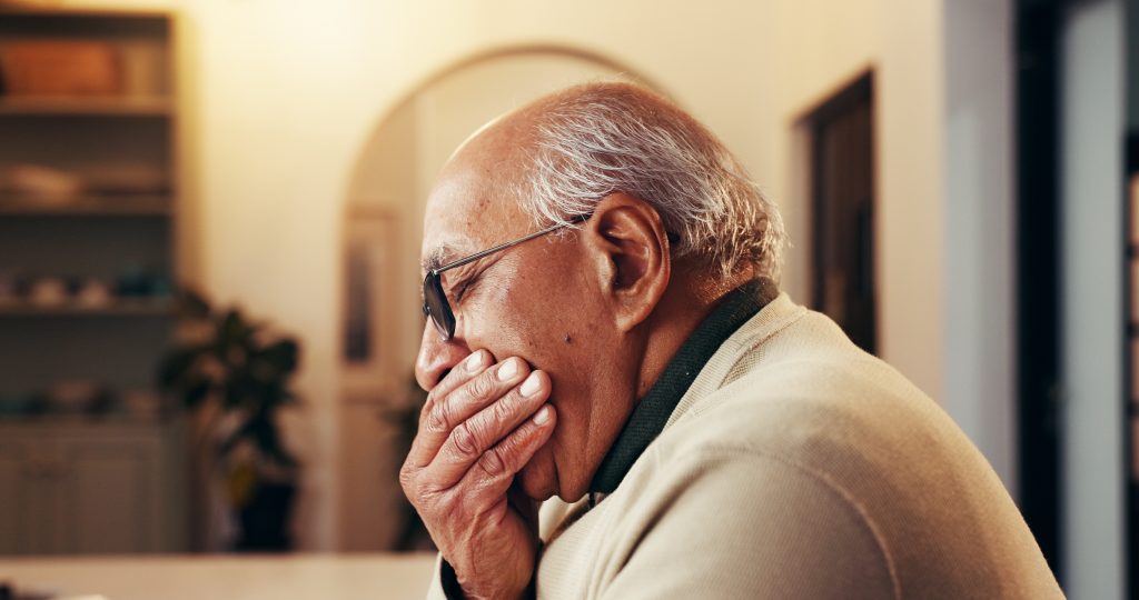 senior man suffering from tooth pain, root canal, infection