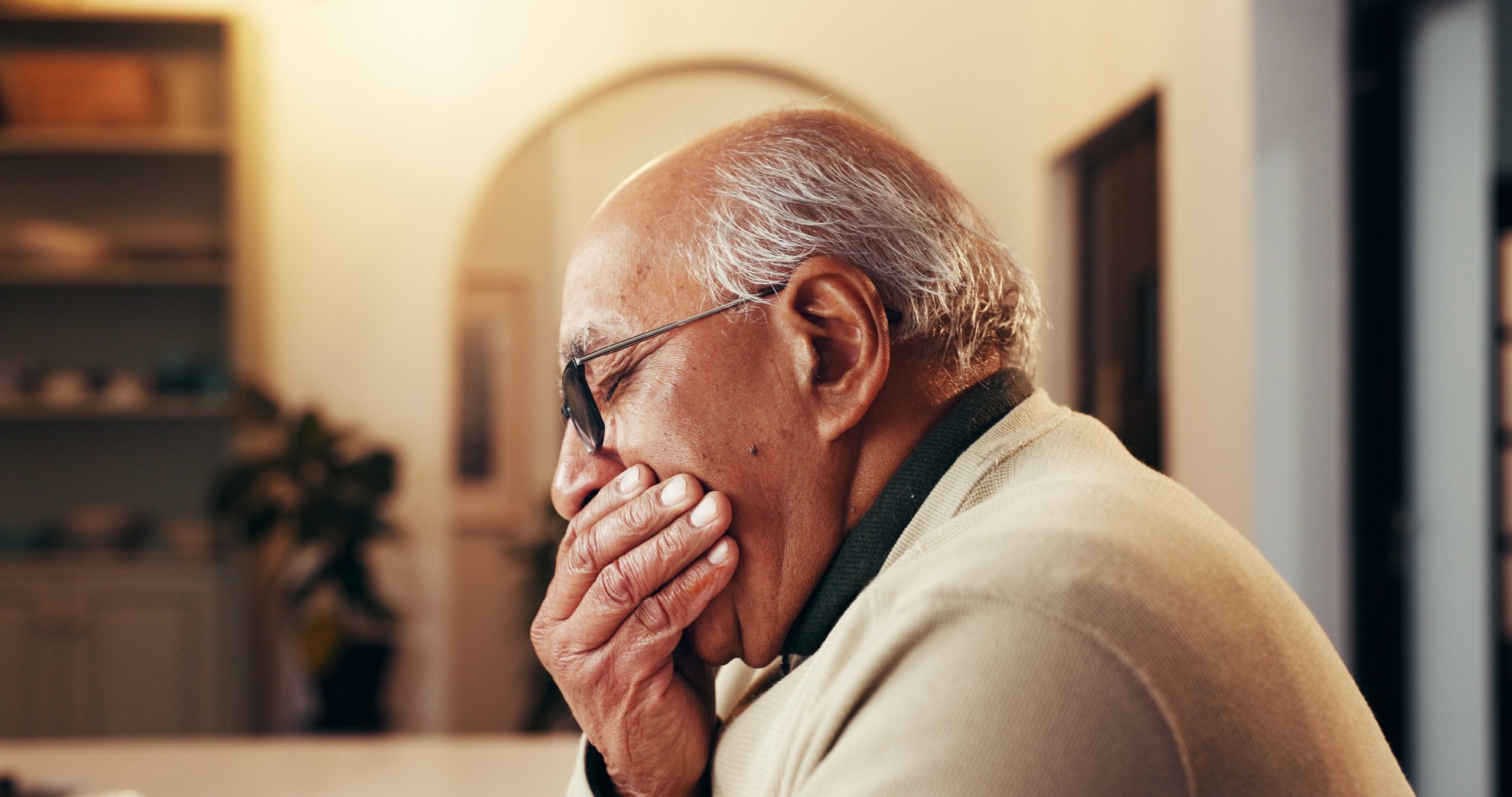 senior man suffering from tooth pain, root canal, infection